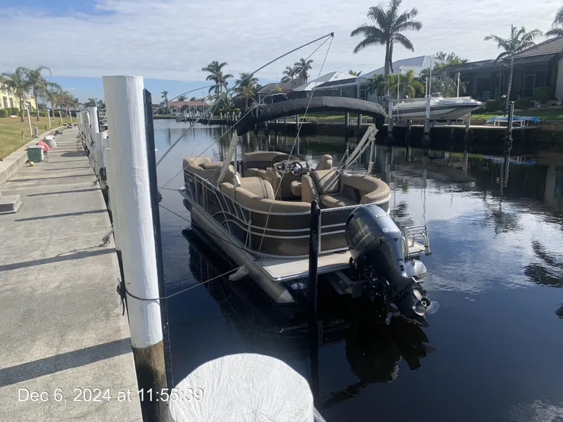 Slide: The Image of 2021 Sylvan Mirage 8522 LZ pontoon boat docked on calm water. - 16