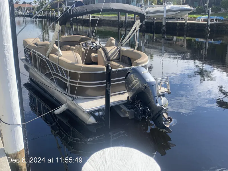 Slide: The Image of 2021 Sylvan Mirage 8522 LZ pontoon boat docked in a sunny canal. - 18