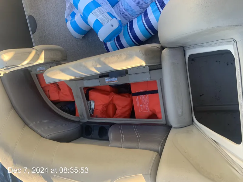 Slide: The Image of Interior of 2021 Sylvan Mirage 8522 LZ boat with open storage compartments. - 27