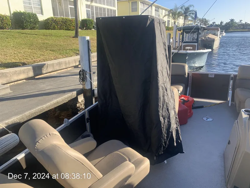 Slide: The Image of 2021 Sylvan Mirage 8522 LZ boat interior with open storage compartment. - 32