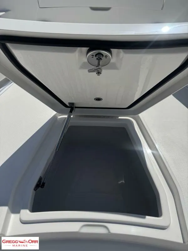 Slide: The Image of Open storage compartment on 2025 Regulator 30XO CROSSOVER boat. - 9