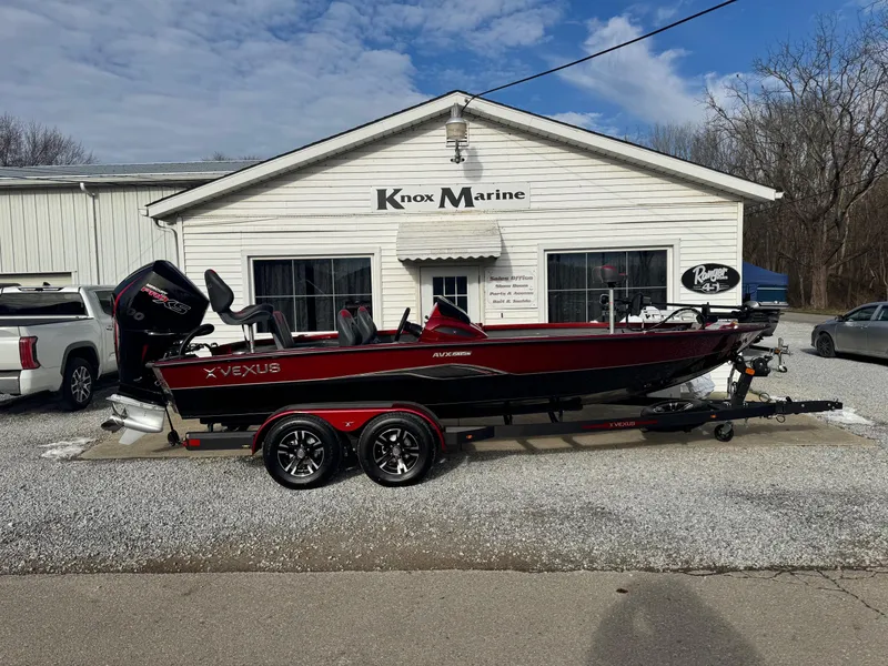 Slide: The Image of 2025 Vexus AVX1985S boat on trailer outside Knox Marine dealership. - 1