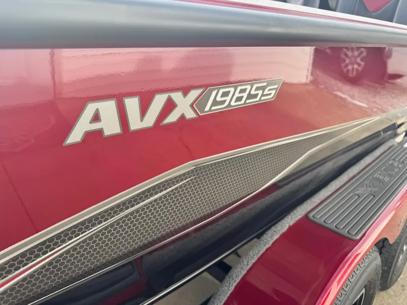 Slide: The Image of 2025 Vexus AVX1985S boat, red exterior with model branding. - 11