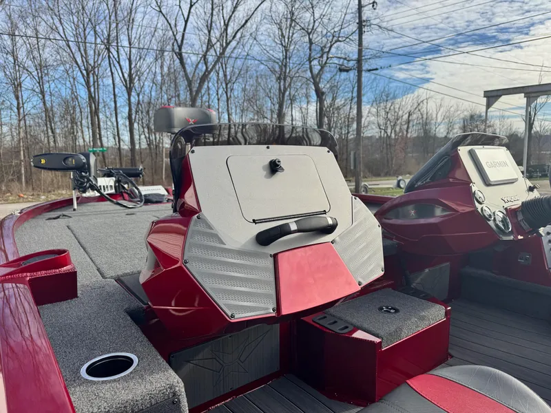 Slide: The Image of 2025 Vexus AVX1985S boat interior with red accents and modern dashboard. - 12