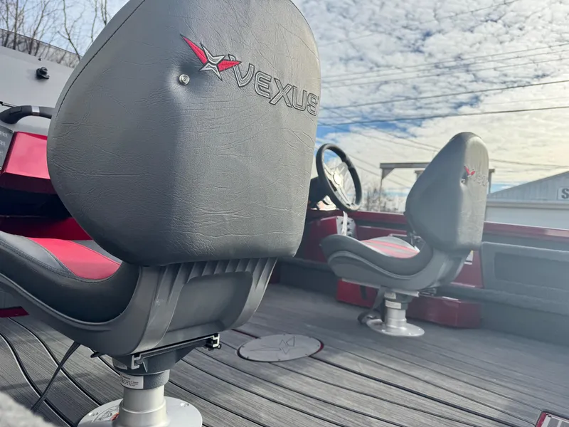 Slide: The Image of 2025 Vexus AVX1985S boat interior with branded seats and steering wheel. - 13