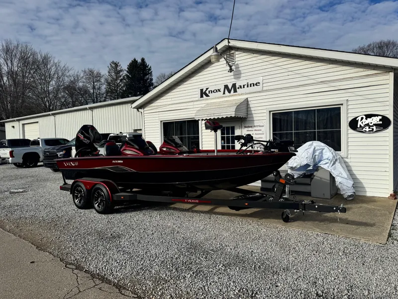 Slide: The Image of 2025 Vexus AVX1985S boat parked outside Knox Marine dealership. - 2