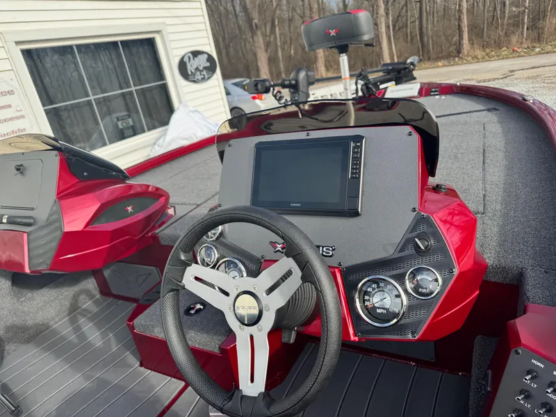 Slide: The Image of 2025 Vexus AVX1985S boat dashboard with steering wheel and digital display. - 5