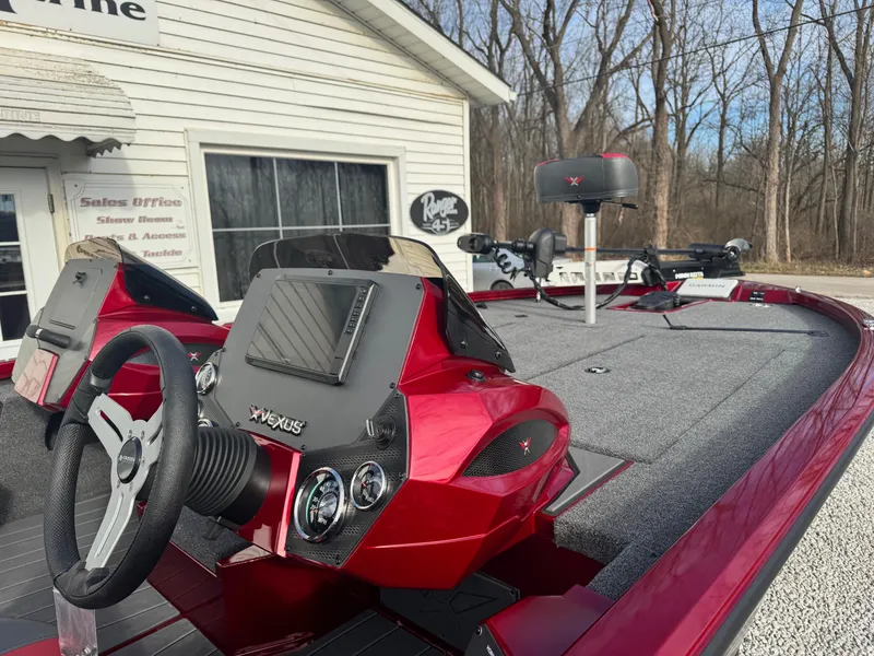 Slide: The Image of 2025 Vexus AVX1985S boat with red accents, parked near a sales office. - 6