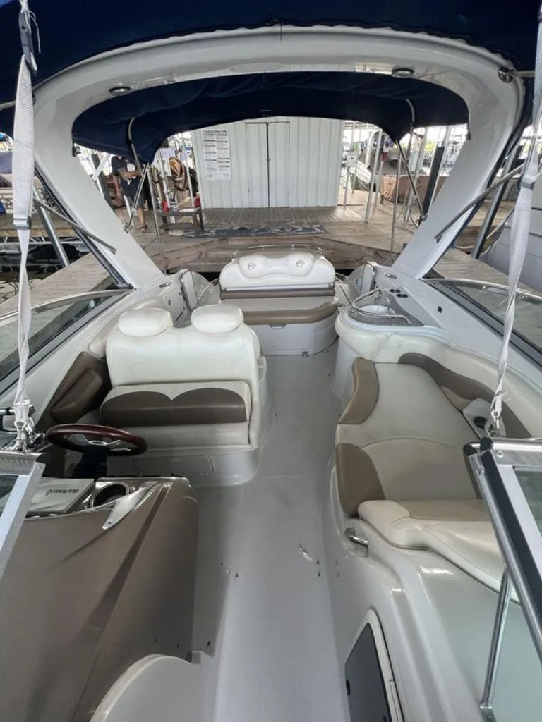Slide: The Image of Interior of 2013 Crownline 325SS boat with spacious seating and canopy. - 10