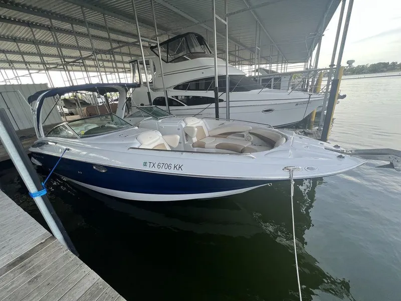 Slide: The Image of 2013 Crownline 325SS boat docked in marina, side view. - 6