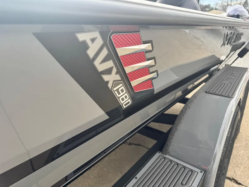 Slide: The Image of 2025 Vexus AVX1980 boat side view with logo detail. - 10