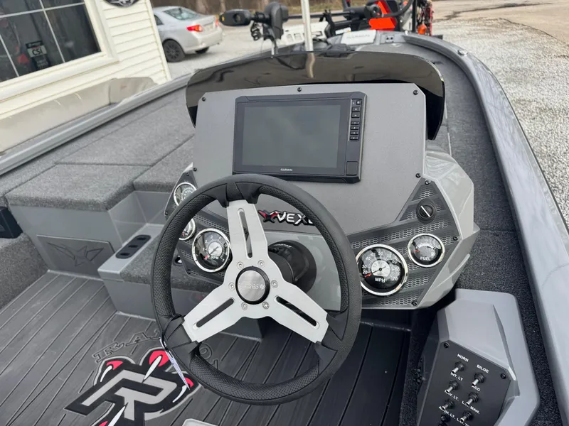 Slide: The Image of 2025 Vexus AVX1980 boat dashboard with steering wheel and digital display. - 5