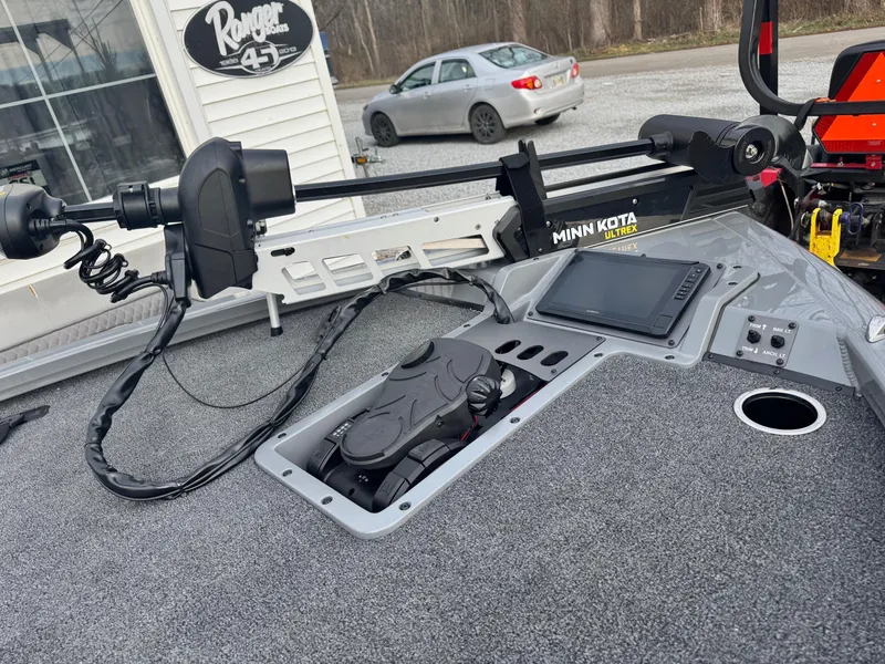 Slide: The Image of 2025 Vexus AVX1980 boat deck with Minn Kota trolling motor and control panel. - 7