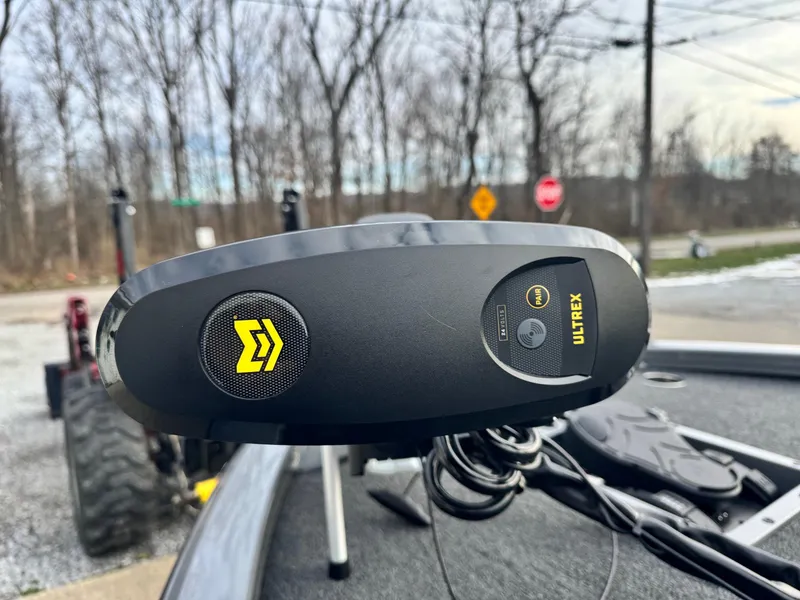 Slide: The Image of Vexus AVX1980 2025 boat with Ultrex trolling motor, parked outdoors. - 8