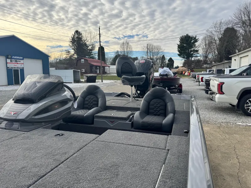 Slide: The Image of 2025 Vexus AVX1980 boat with dual seats in a parking area. - 9