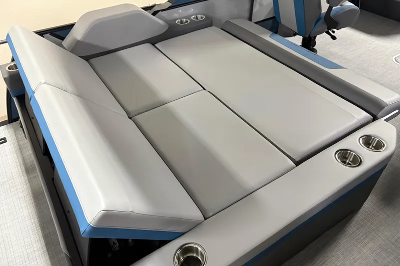 Slide: The Image of 2025 South Bay 500 boat interior with gray seating and cup holders. - 6