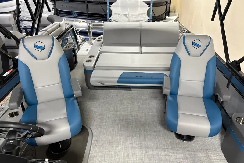 Slide: The Image of 2025 South Bay 500 boat interior with blue and gray seating, modern design. - 8