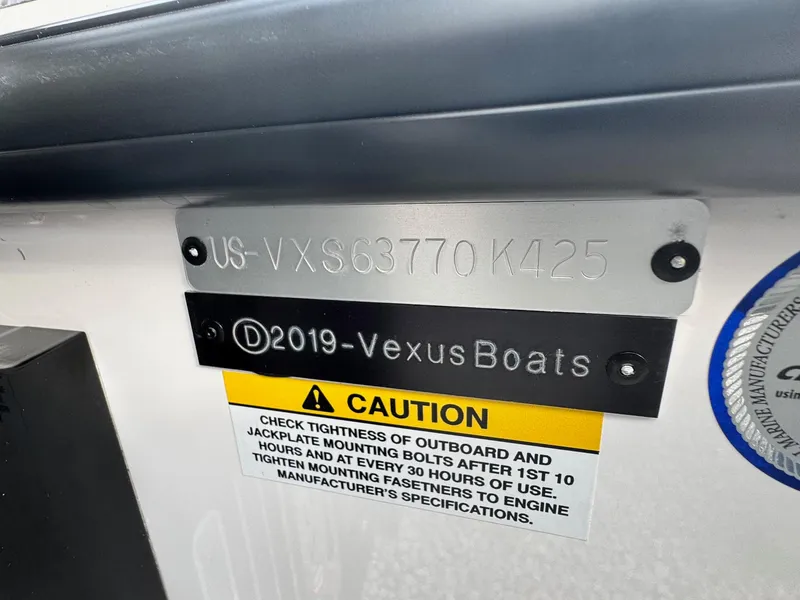 Slide: The Image of Vexus VXS21 2025 boat identification plate with caution label and serial number. - 4