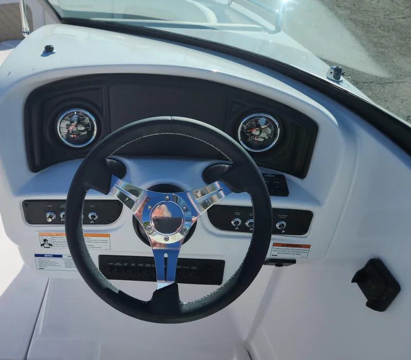Slide: The Image of Steering wheel and dashboard of 2025 SouthWind 2400 SD boat. - 10