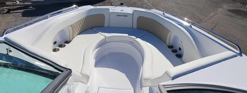 Slide: The Image of 2025 SouthWind 2400 SD boat interior with spacious seating and cup holders. - 12