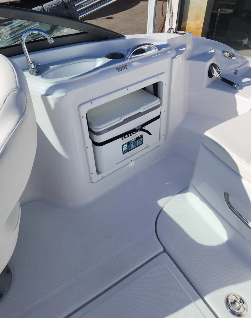 Slide: The Image of 2025 SouthWind 2400 SD boat interior with built-in cooler and seating area. - 14
