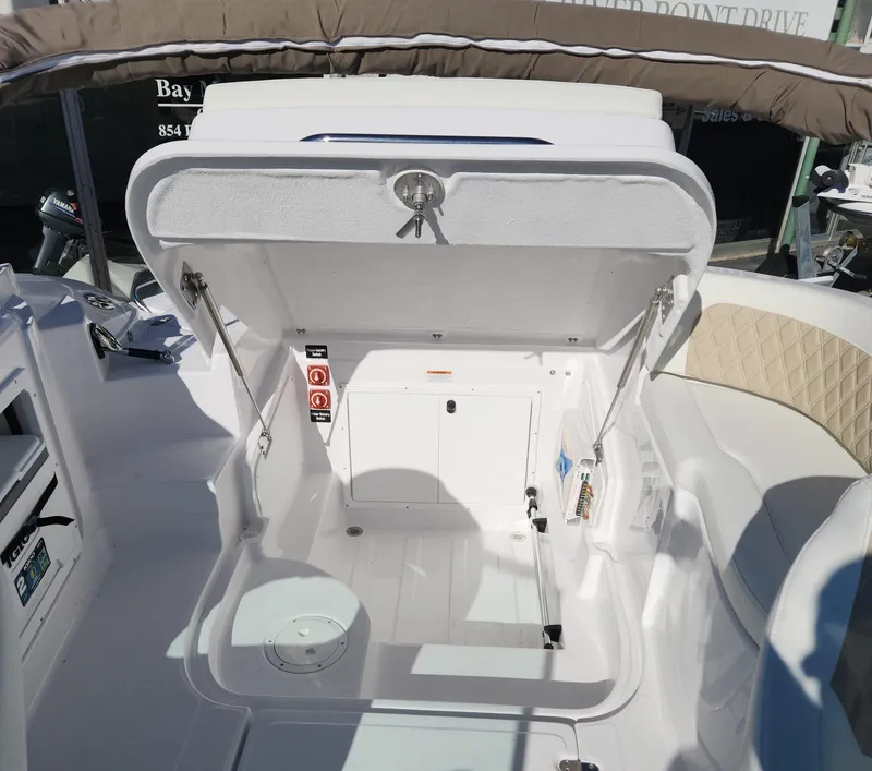 Slide: The Image of 2025 SouthWind 2400 SD boat storage compartment open, showcasing interior features. - 15