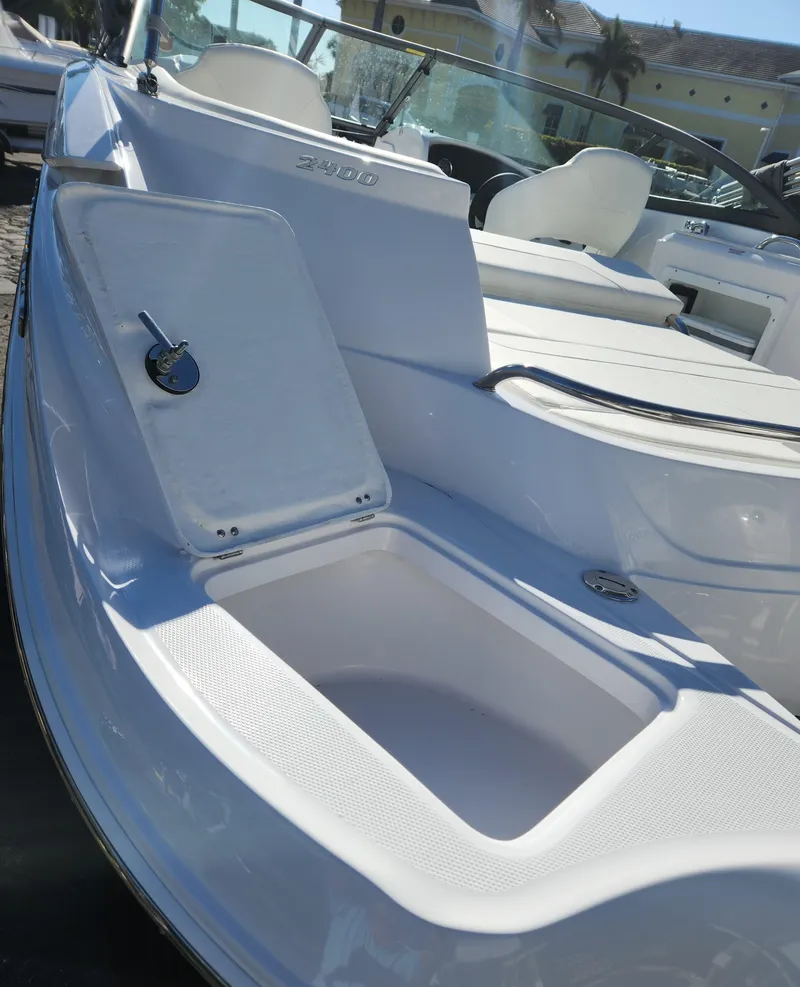 Slide: The Image of 2025 SouthWind 2400 SD boat with open storage compartment, sleek white design. - 20