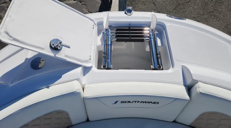 Slide: The Image of 2025 SouthWind 2400 SD boat with open storage compartment and ladder. - 22