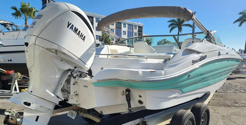 Slide: The Image of 2025 SouthWind 2400 SD boat with Yamaha engine, parked on trailer, sunny day. - 3
