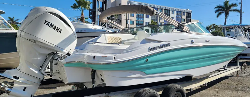 Slide: The Image of 2025 SouthWind 2400 SD boat with Yamaha engine on trailer, turquoise and white design. - 5
