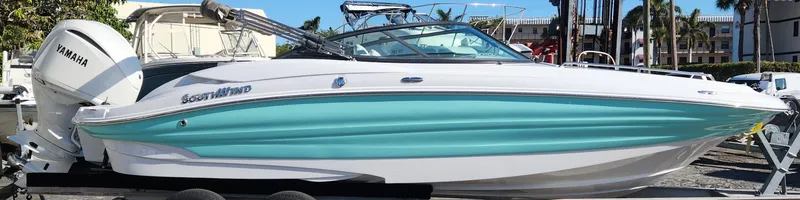 Slide: The Image of 2025 SouthWind 2400 SD boat with Yamaha engine, docked in a sunny marina. - 7