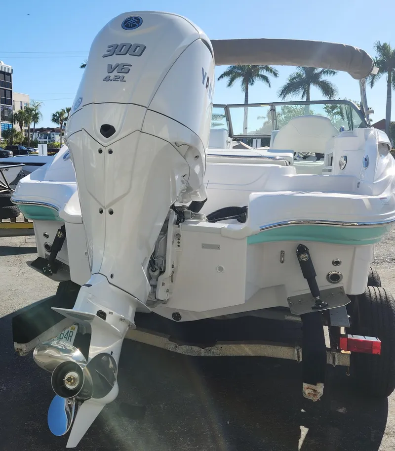 Slide: The Image of 2025 SouthWind 2400 SD boat with Yamaha 300 V6 engine, parked outdoors. - 8