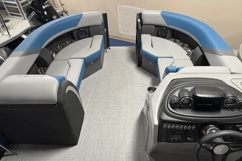 Slide: The Image of Interior of 2025 South Bay 200 boat with blue and gray seating and control panel. - 3