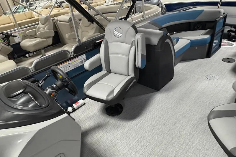 Slide: The Image of 2025 South Bay 200 boat interior with modern seating and steering console. - 7