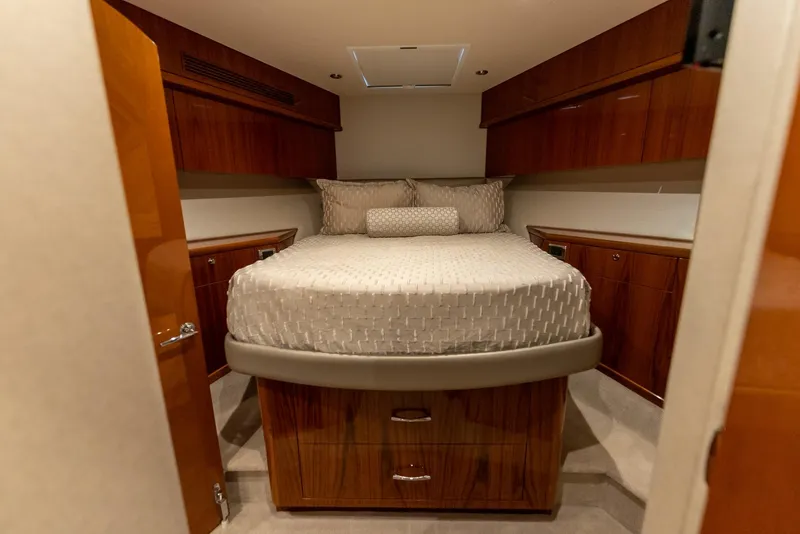 Slide: The Image of Luxurious cabin interior of 2018 Hatteras GT70 yacht with elegant wood finish. - 25
