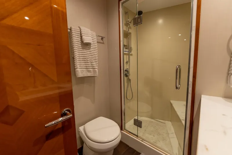 Slide: The Image of Luxurious bathroom in 2018 Hatteras GT70 yacht with glass shower and modern fixtures. - 33