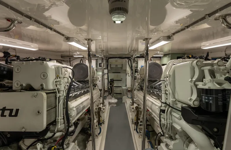 Slide: The Image of Engine room of 2018 Hatteras GT70 yacht, featuring dual MTU engines. - 36