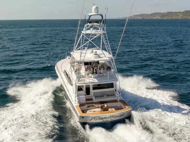 Slide: The Image of 2018 Hatteras GT70 yacht cruising on open sea, rear view. - 5