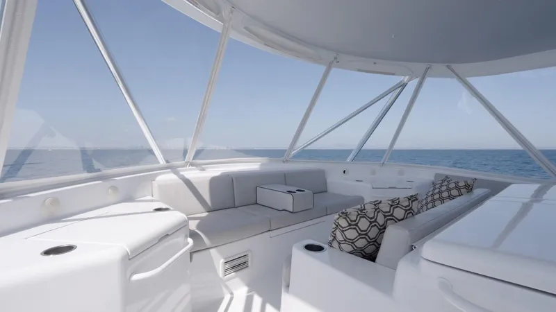 Slide: The Image of Luxurious interior of 2018 Hatteras GT70 yacht with ocean view and elegant seating. - 9