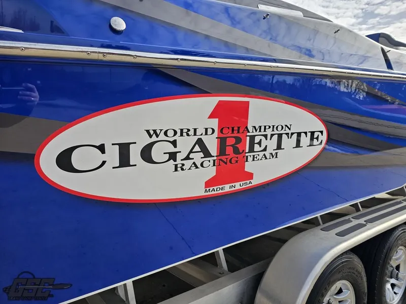 Slide: The Image of 2012 Cigarette 39' Top Gun Unlimited boat with World Champion Racing Team logo. - 10