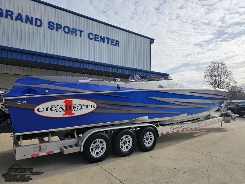 Slide: The Image of 2012 Cigarette 39' Top Gun Unlimited boat on trailer at Grand Sport Center. - 11