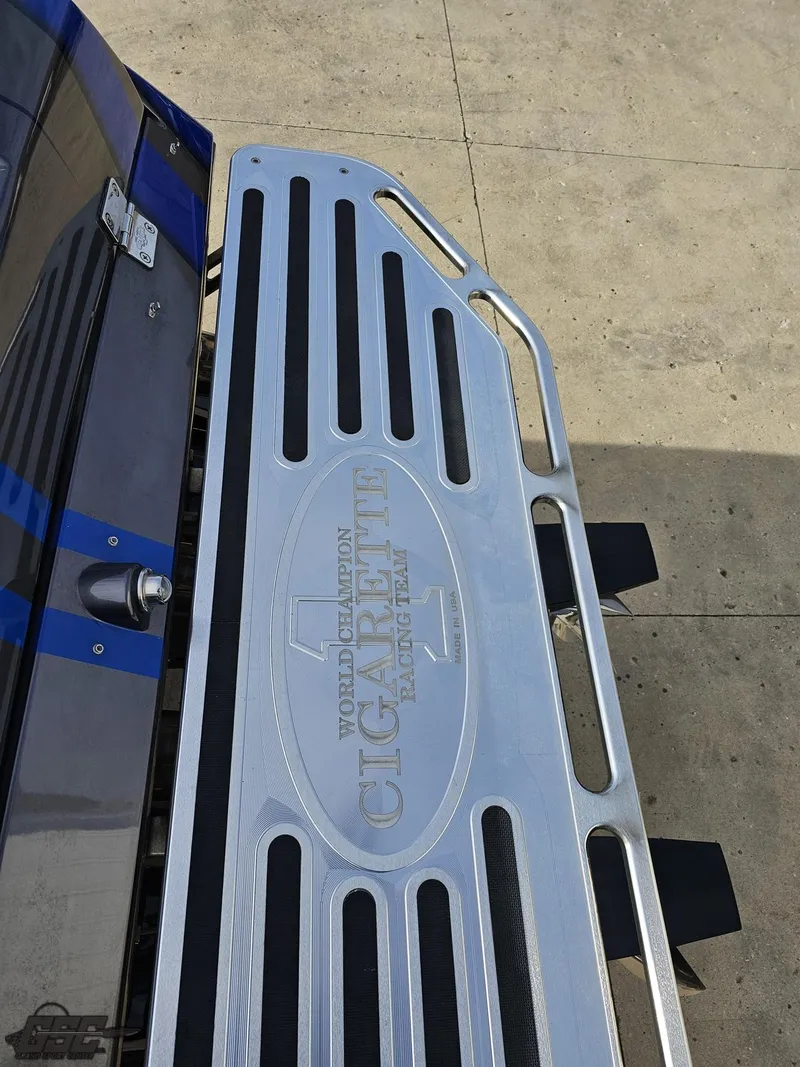 Slide: The Image of 2012 Cigarette 39' Top Gun Unlimited boat platform with logo detail. - 32