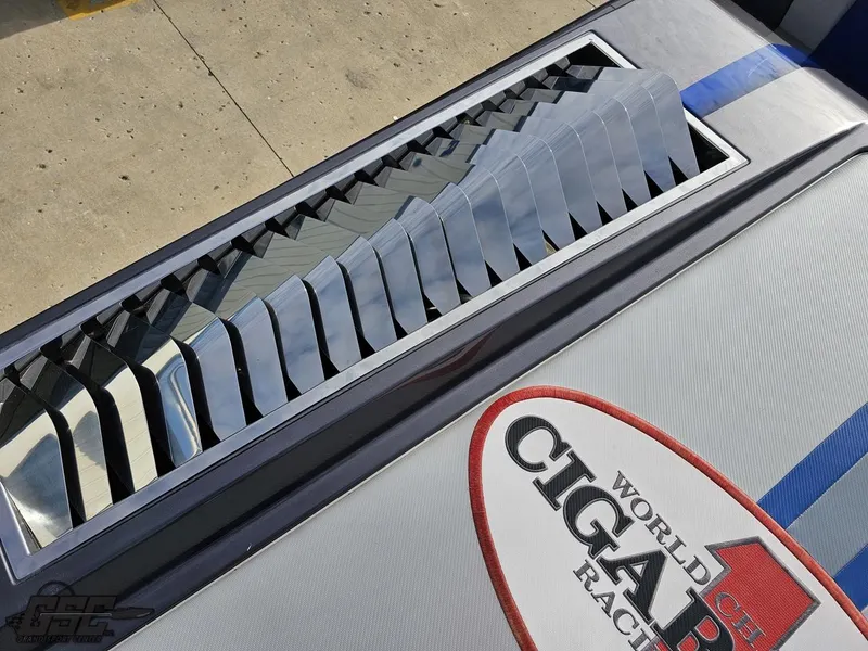 Slide: The Image of 2012 Cigarette 39' Top Gun Unlimited boat with sleek design and racing logo. - 38