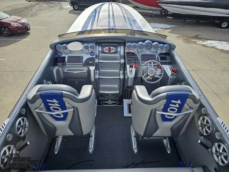 Slide: The Image of 2012 Cigarette 39' Top Gun Unlimited boat cockpit with dual seats and advanced controls. - 40