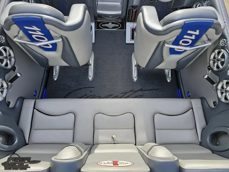 Slide: The Image of Interior of 2012 Cigarette 39' Top Gun Unlimited boat with gray and blue seating. - 41