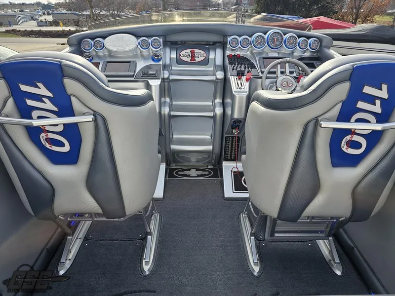 Slide: The Image of 2012 Cigarette 39' Top Gun Unlimited cockpit with dual seats and advanced controls. - 42