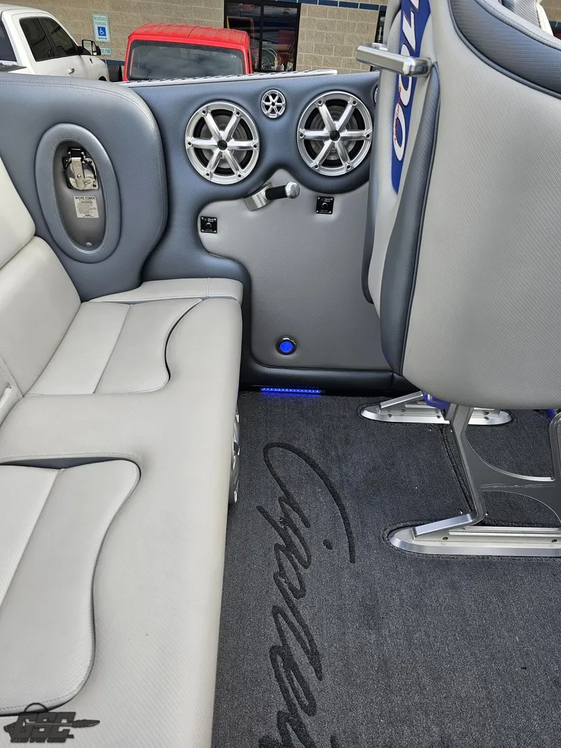 Slide: The Image of 2012 Cigarette 39' Top Gun Unlimited interior with gray seating and audio system. - 43