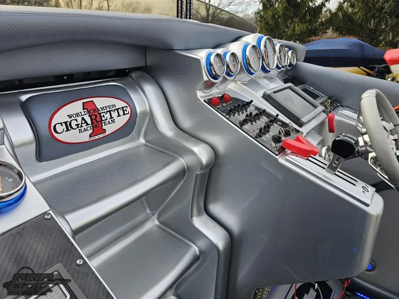 Slide: The Image of 2012 Cigarette 39' Top Gun Unlimited dashboard with gauges and controls. - 47