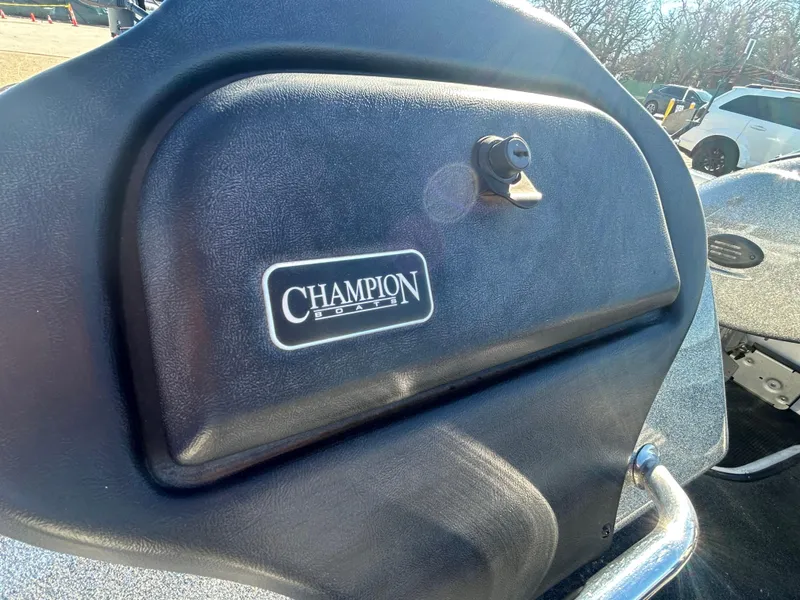 Slide: The Image of 2009 Champion 210 Elite boat with Mercury outboard motor on sandy shore. - 18