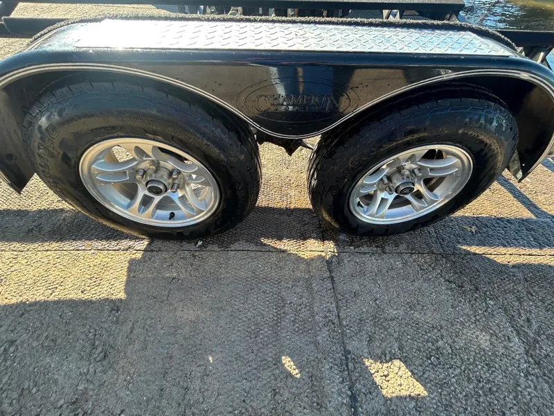 Slide: The Image of Worn tire on 2009 Champion 210 Elite vehicle, showing tread wear and surface texture. - 37